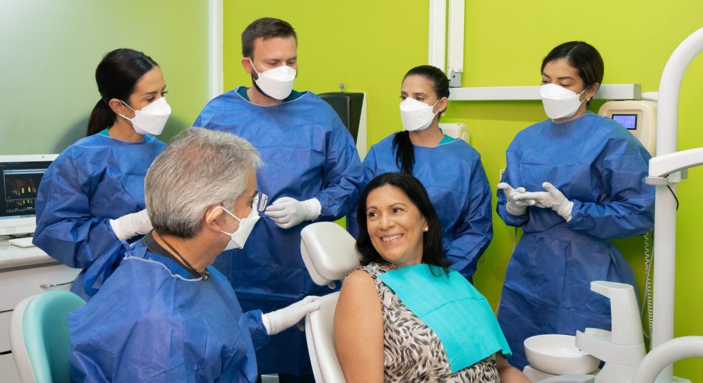 Full Mouth Dental Implant patient talking to the doctors in Mexico.