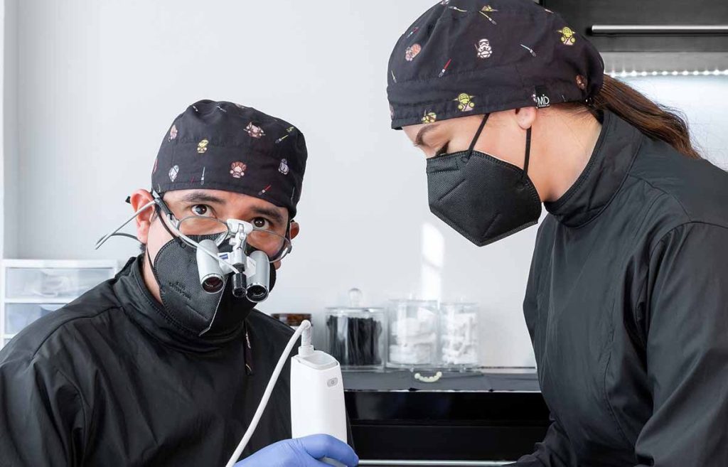 2 Dentists in mexico perfoming a dental procedure