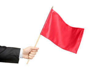 man holding red flag